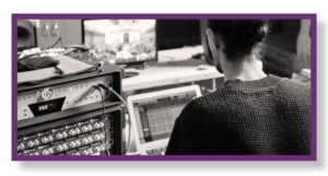 Image of a sound engineer and his recording equipment